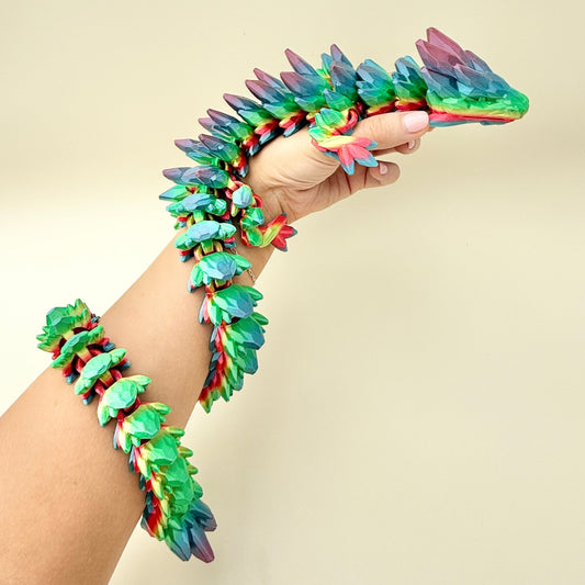 Extra-large flexible dragon fidget toy with a bold rainbow colour gradient