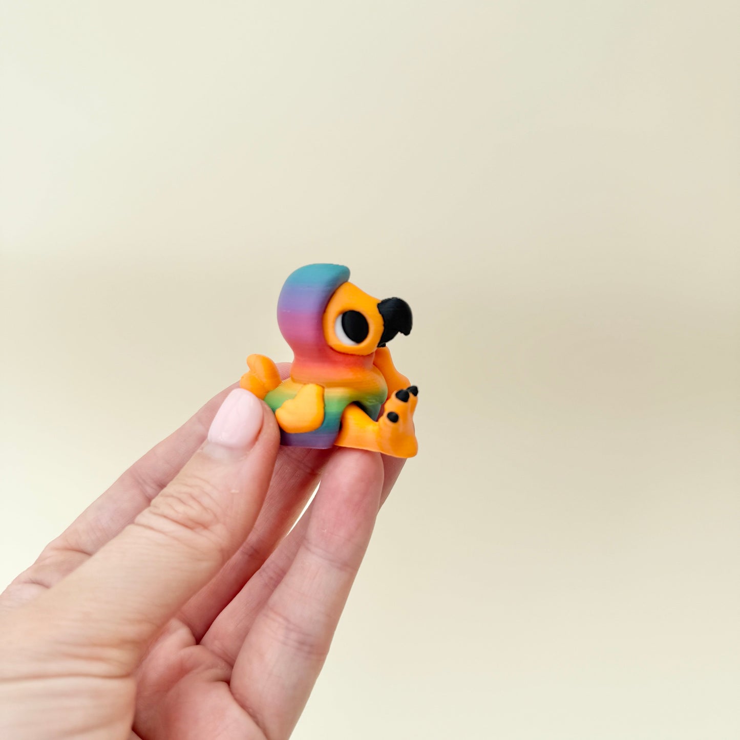 miniature articulated bird fidget with smooth ridges for thumb tracing
