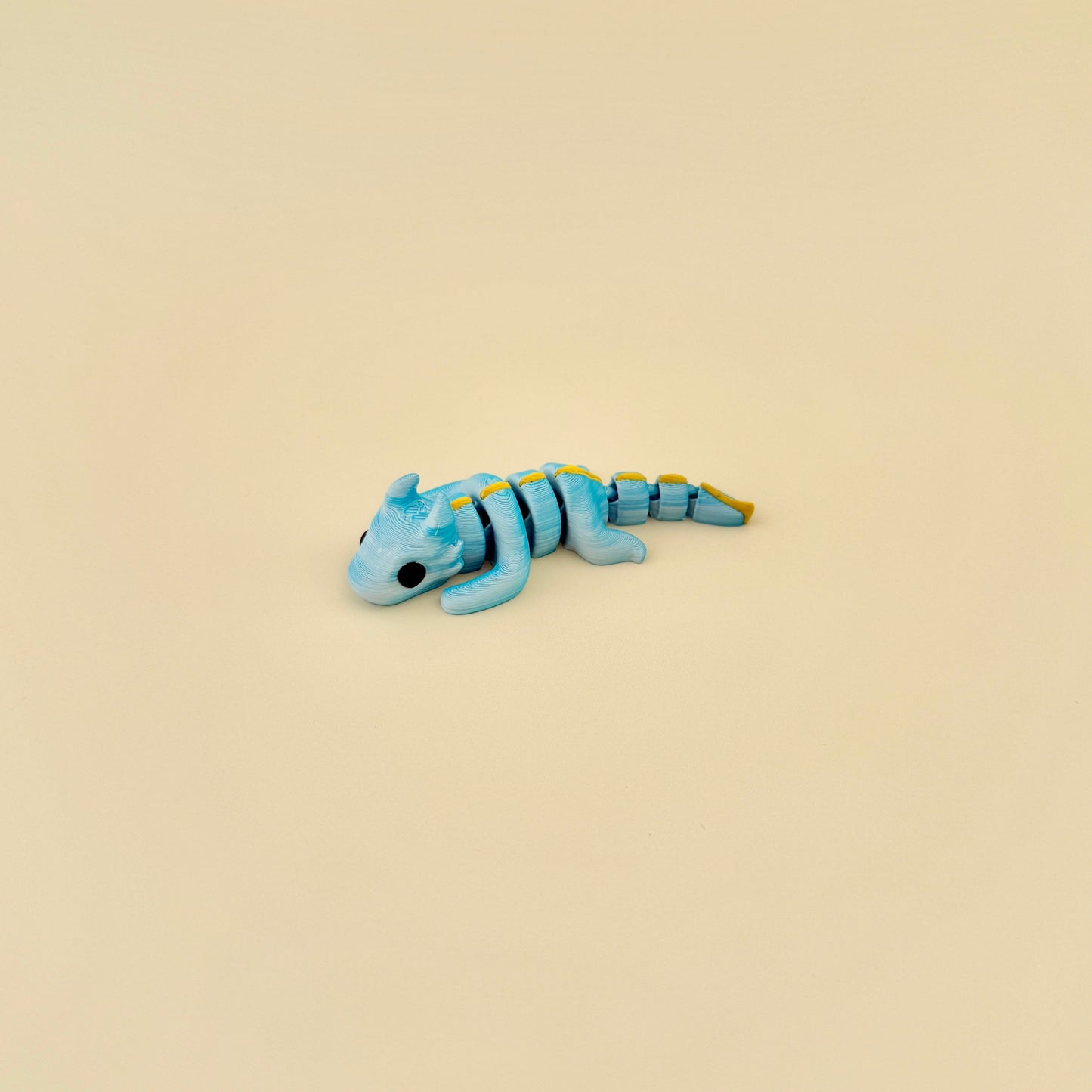 A highly flexible and moveable axolotl fidget toy, ideal for sensory stimulation.
