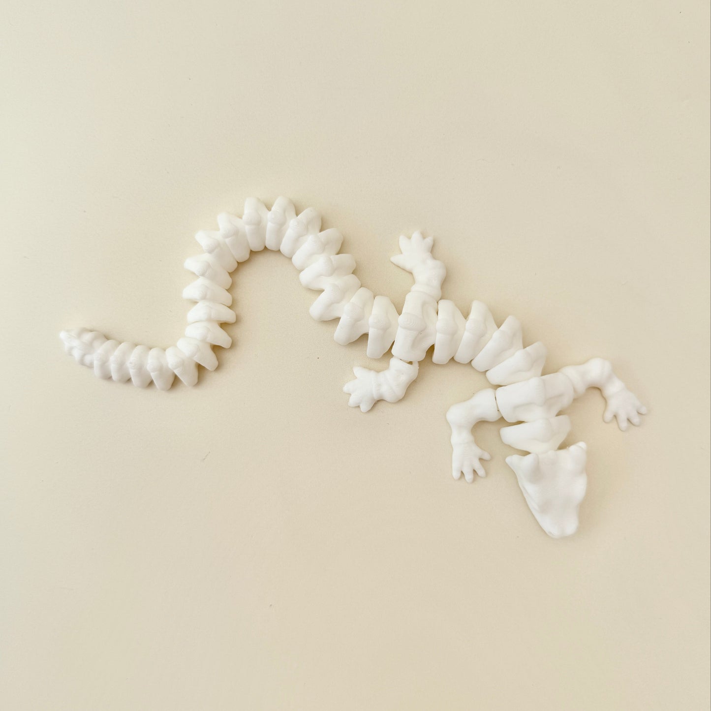 large dragon fidget toy styled as a skeletal figure