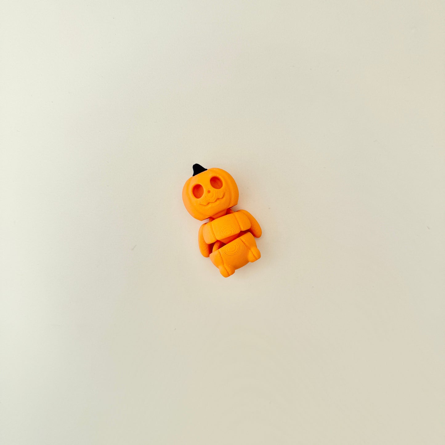 compact pumpkin fidget with flexible movement