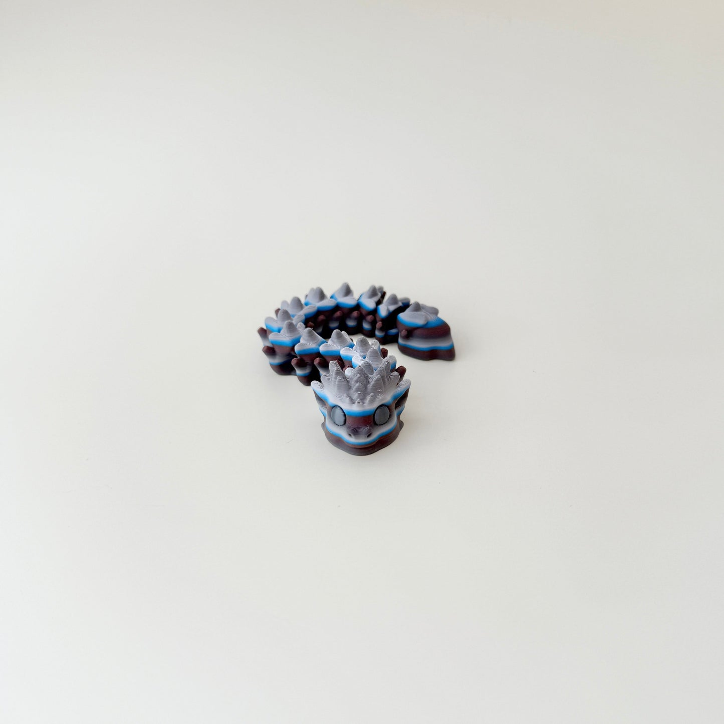 Flexible snake figure with textured segments and spooky Halloween style