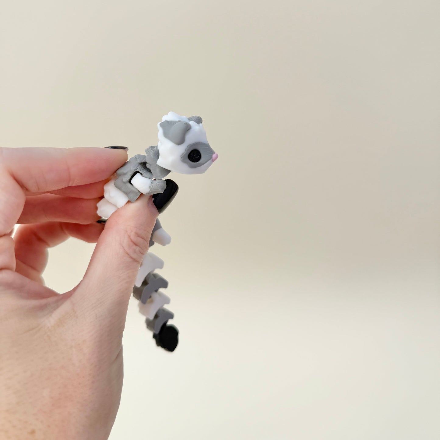 Hand-friendly ferret fidget with flexible spine and tail; soothing motion for gentle stims and regulation.