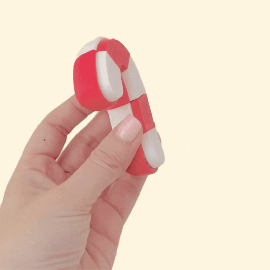 handheld sensory clicker, candy cane shape, optional quiet click, wrist-strap ready