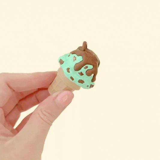 Ice cream-shaped fidget with raised patterns and a solid, compact build for sensory play.