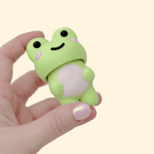 A chunky handheld frog clicker designed for grounding, rhythm and sensory comfort