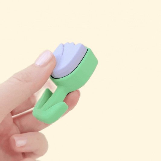 Small tulip-shaped fidget toy in lilac and green, perfect for on-the-go stress relief and focus.