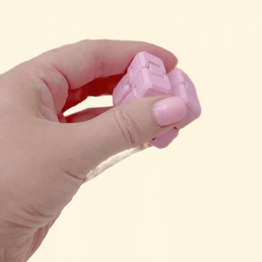 Pocket-sized folding fidget with smooth hinges designed for one-handed sensory play.