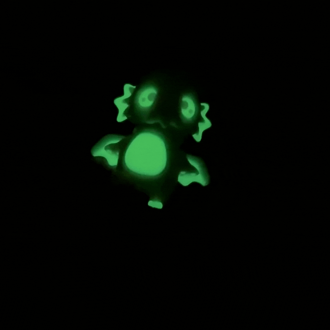 quiet articulated creature with glow accents designed for tactile stimming and display