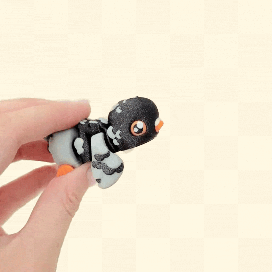 Playful bird-shaped sensory toy with a textured design and vibrant features.