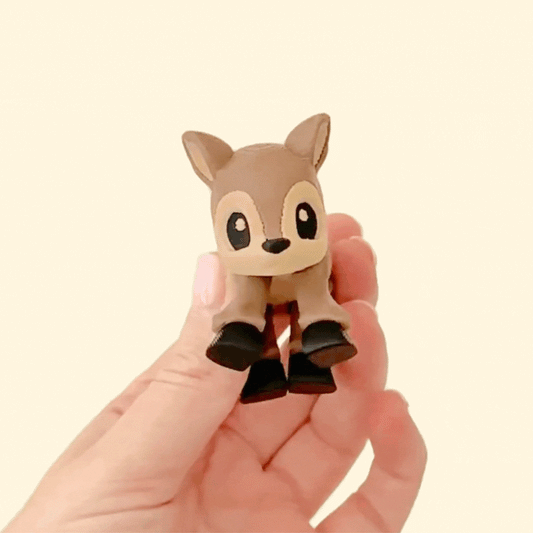 Fully articulated brown and beige deer fidget toy with black hooves and a black nose, standing upright.