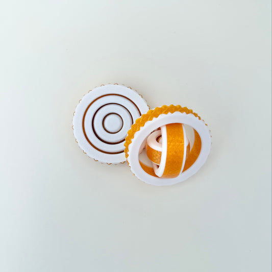 Quiet, flowing spinner designed for focus, grounding, and subtle fidgeting.