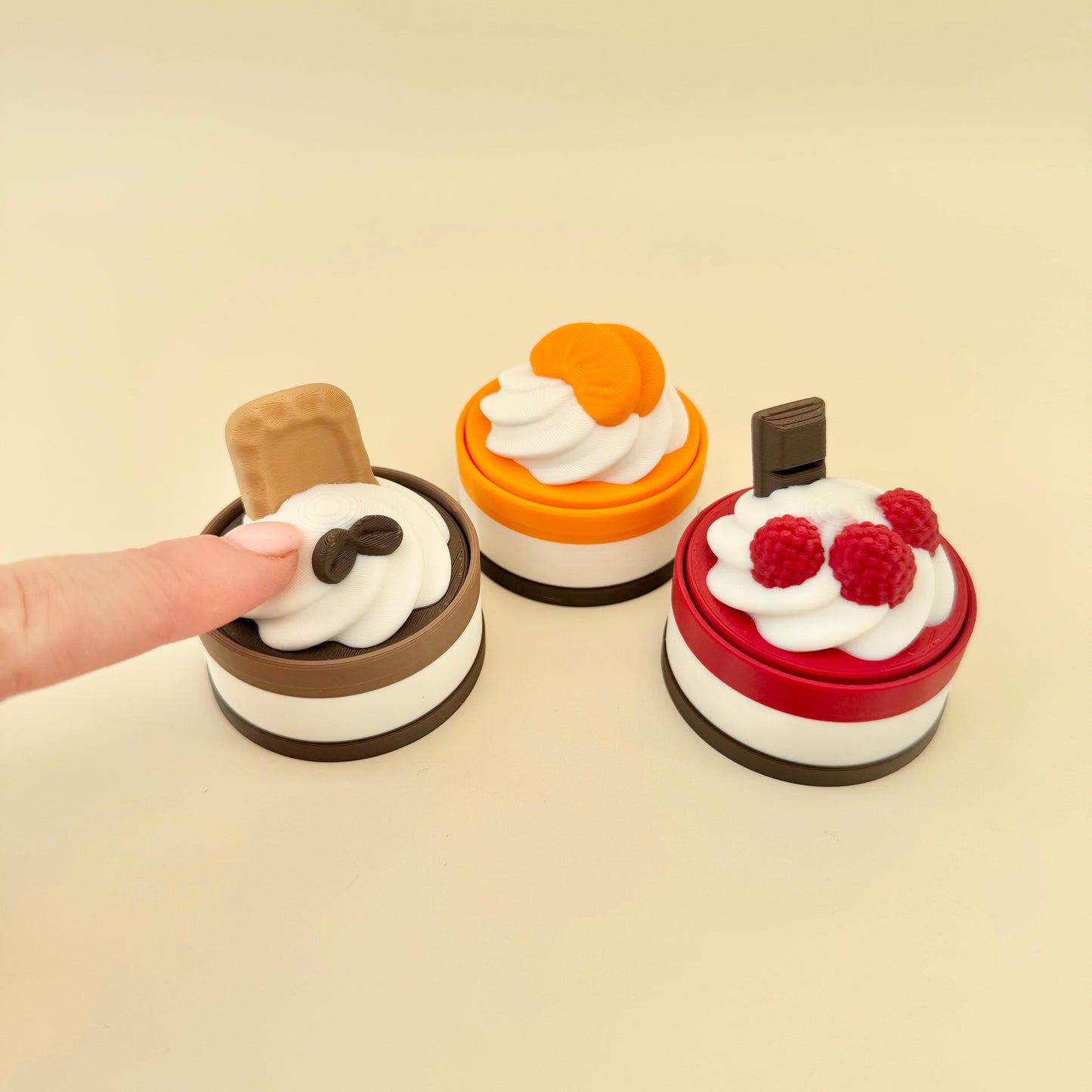 Small handheld press click fidget with textured layers for tracing, satisfying push feedback and a calming sensory feel.