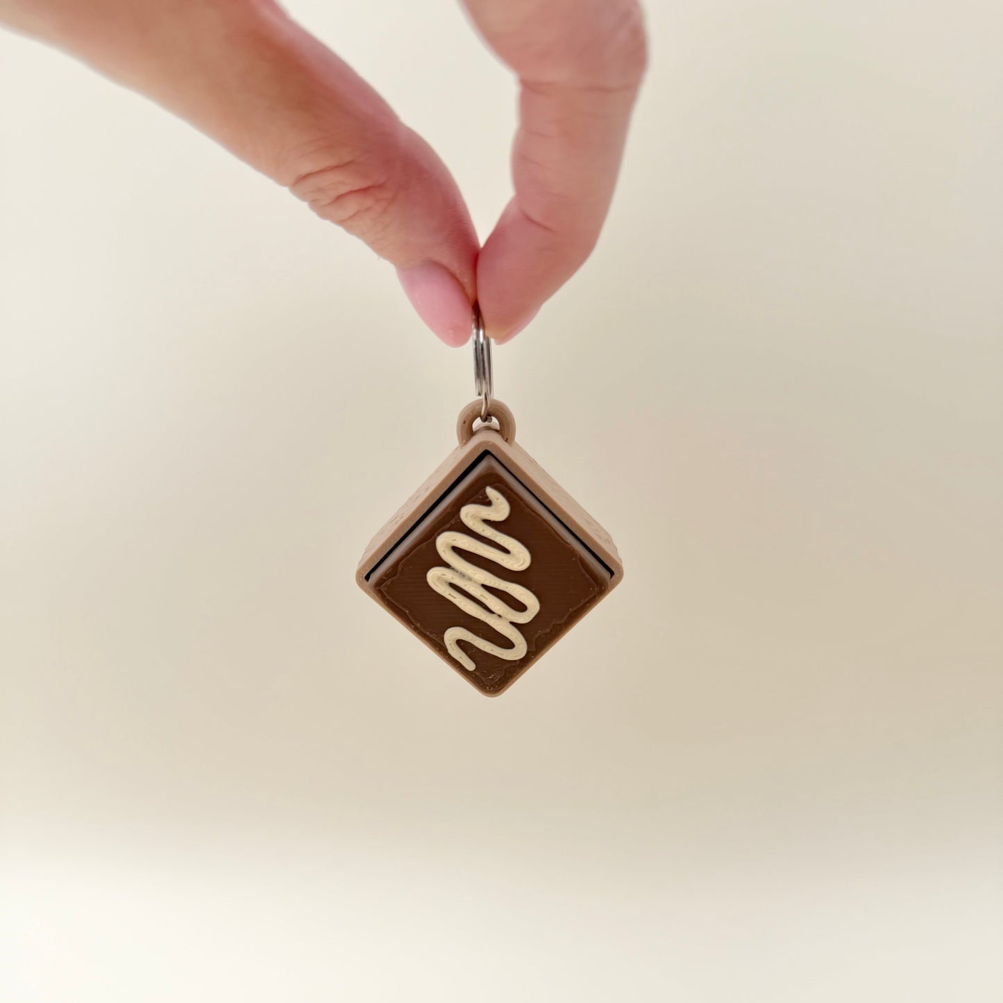 Small handheld clicker fidget for focus, calming sensory input and busy hands, with click or quiet click option.