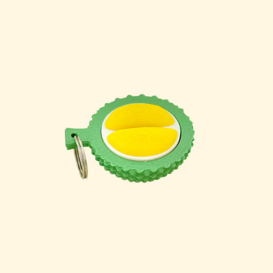 Sensory clicker shaped like a tropical durian fruit with attached keyring