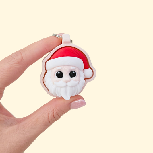 Cartoon Santa fidget, chunky 3D sculpt with smooth face and raised beard, keyring loop, click or quiet option.