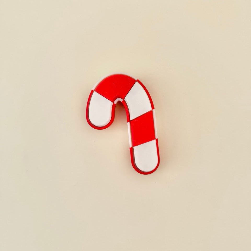 striped holiday clicker with segmented tiles for repeatable tactile feedback