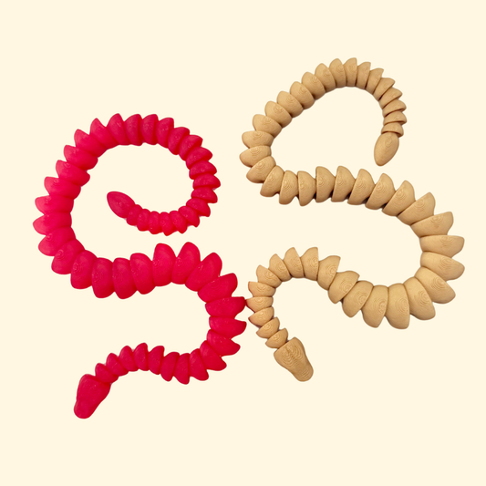 Smooth articulated snake toy in seasonal red or gold for sensory play.