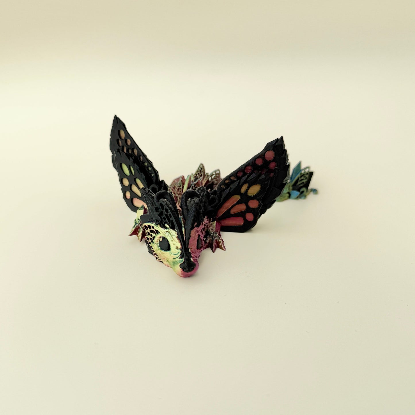 Highly textured sensory dragon toy with winged design and smooth movement