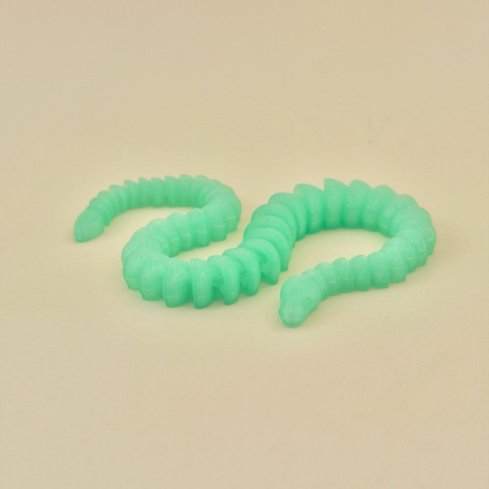 Compact flexible snake fidget with segmented body for smooth bends.