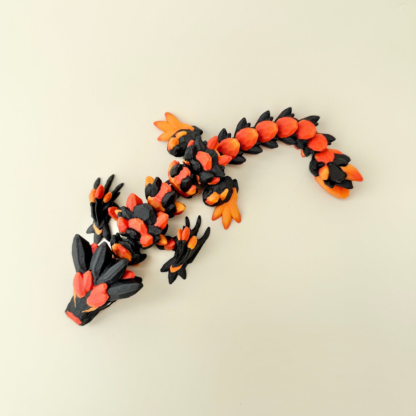 detailed dragon fidget with bold black accents and articulated movement