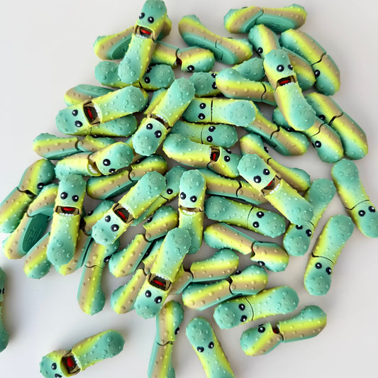 Compact pickle-shaped fidget toy in a green gradient finish, perfect for tactile sensory play.