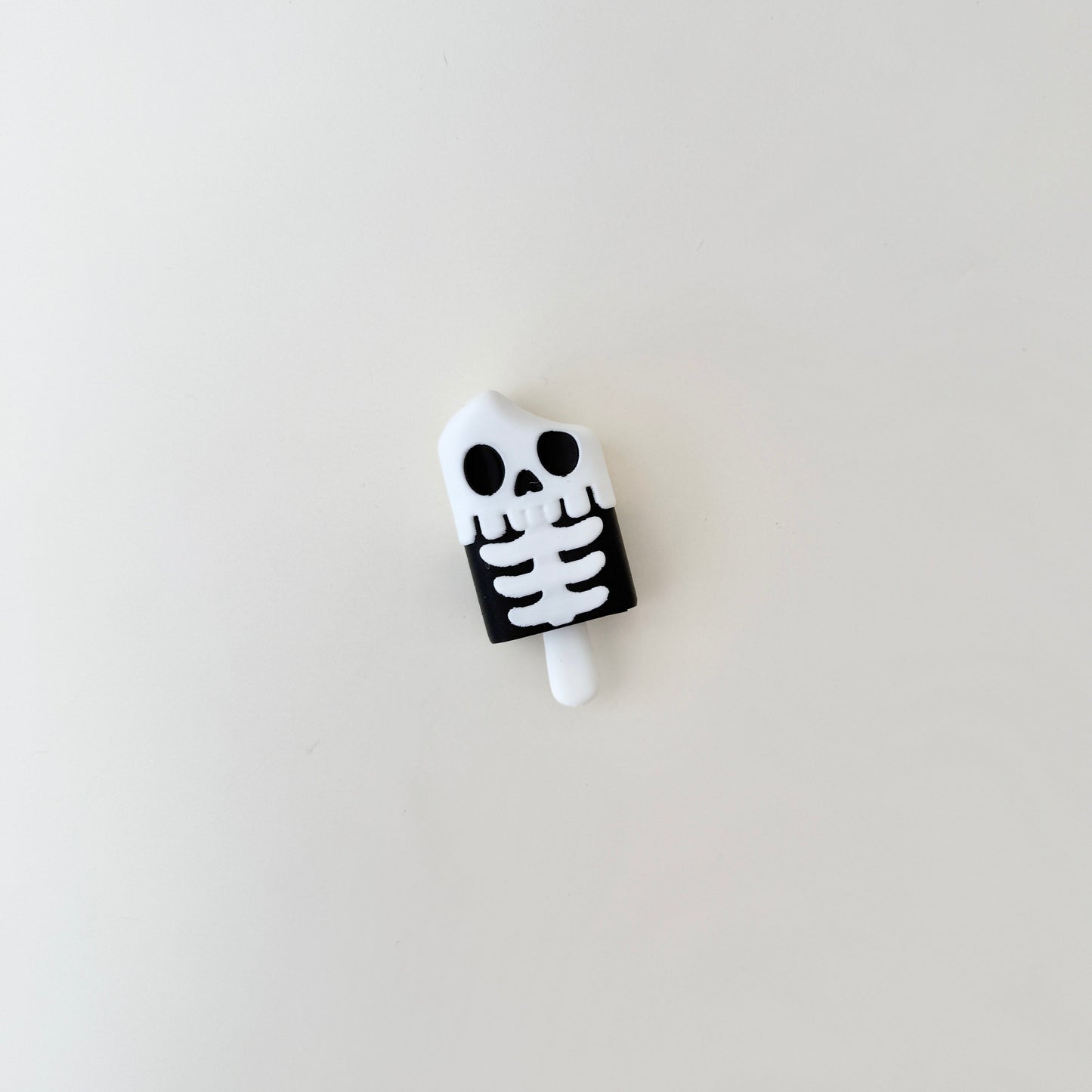 compact skeleton-themed clicker suitable for bags, keys and lanyards