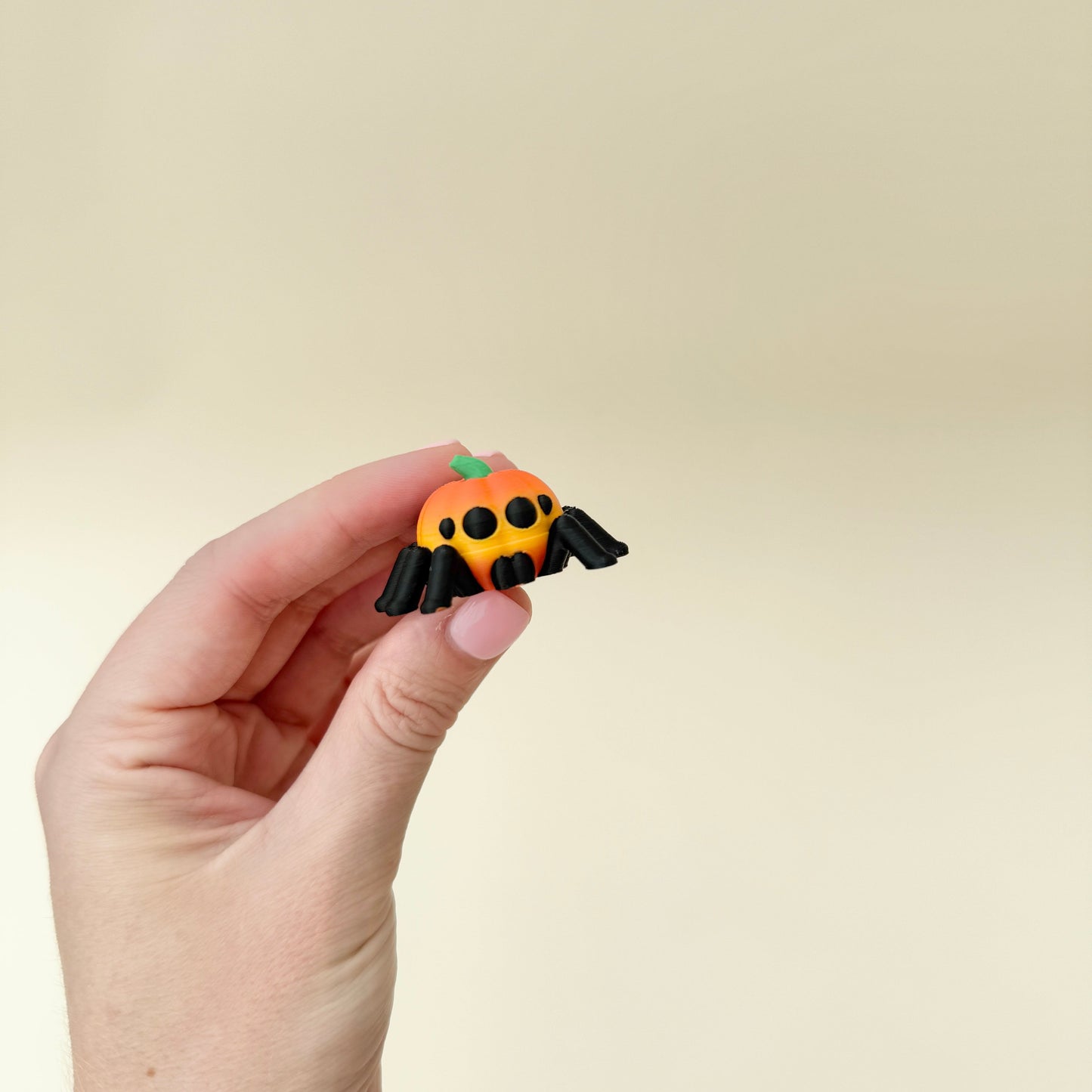 mini pumpkin-themed spider fidget designed for grounding and focus