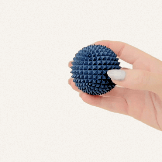 Solid structured sensory tool for squeezing, rolling and grounding without movement or noise.