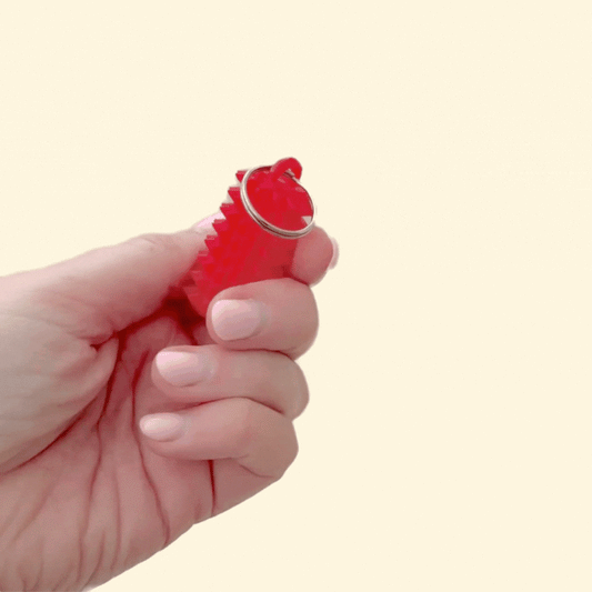 Compact handheld pain stim designed for strong tactile feedback and grounding.