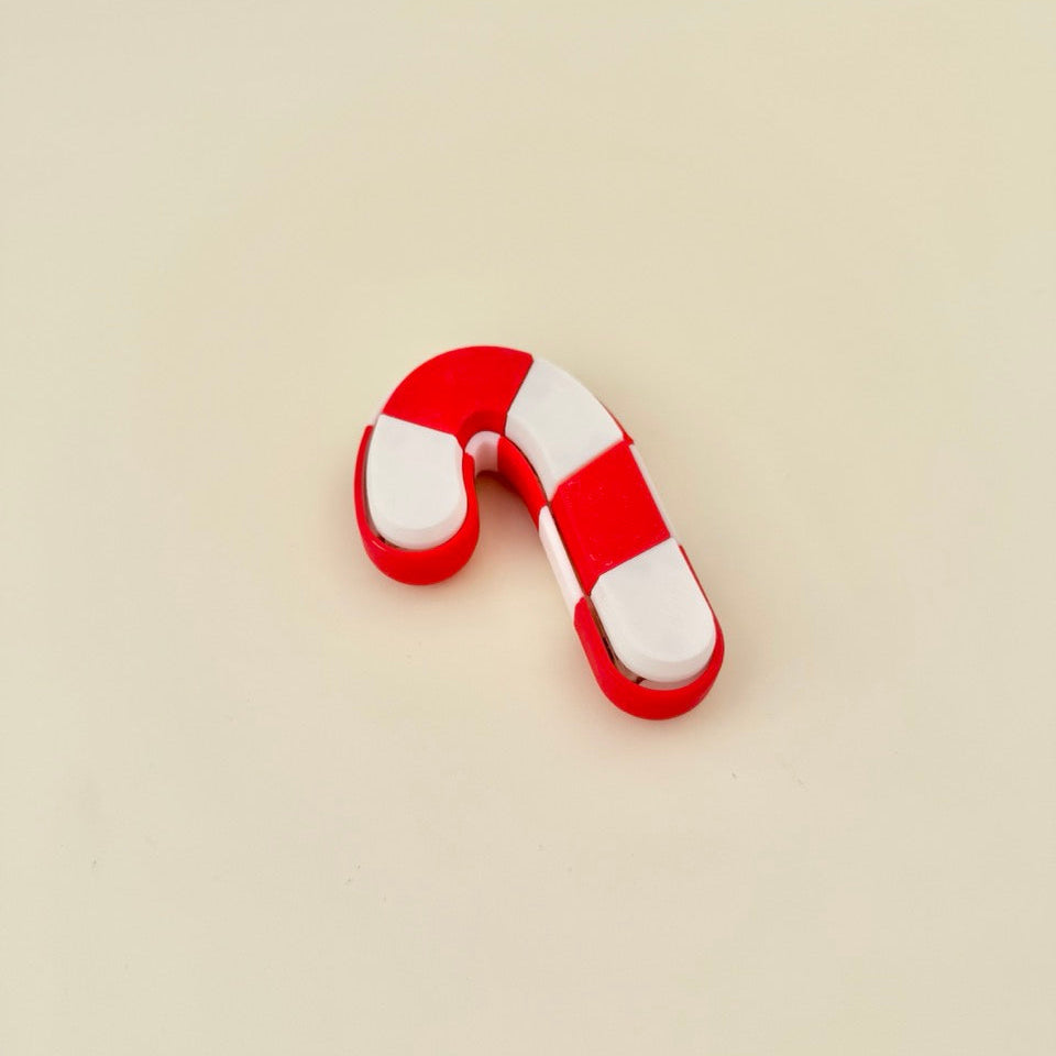 chunky 8 cm candy-cane clicker for focus, grounding and rhythmic popping