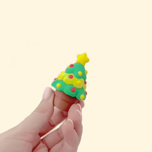 Green tree with star topper and pot button; compact desktop fidget for focus, grounding, and play.