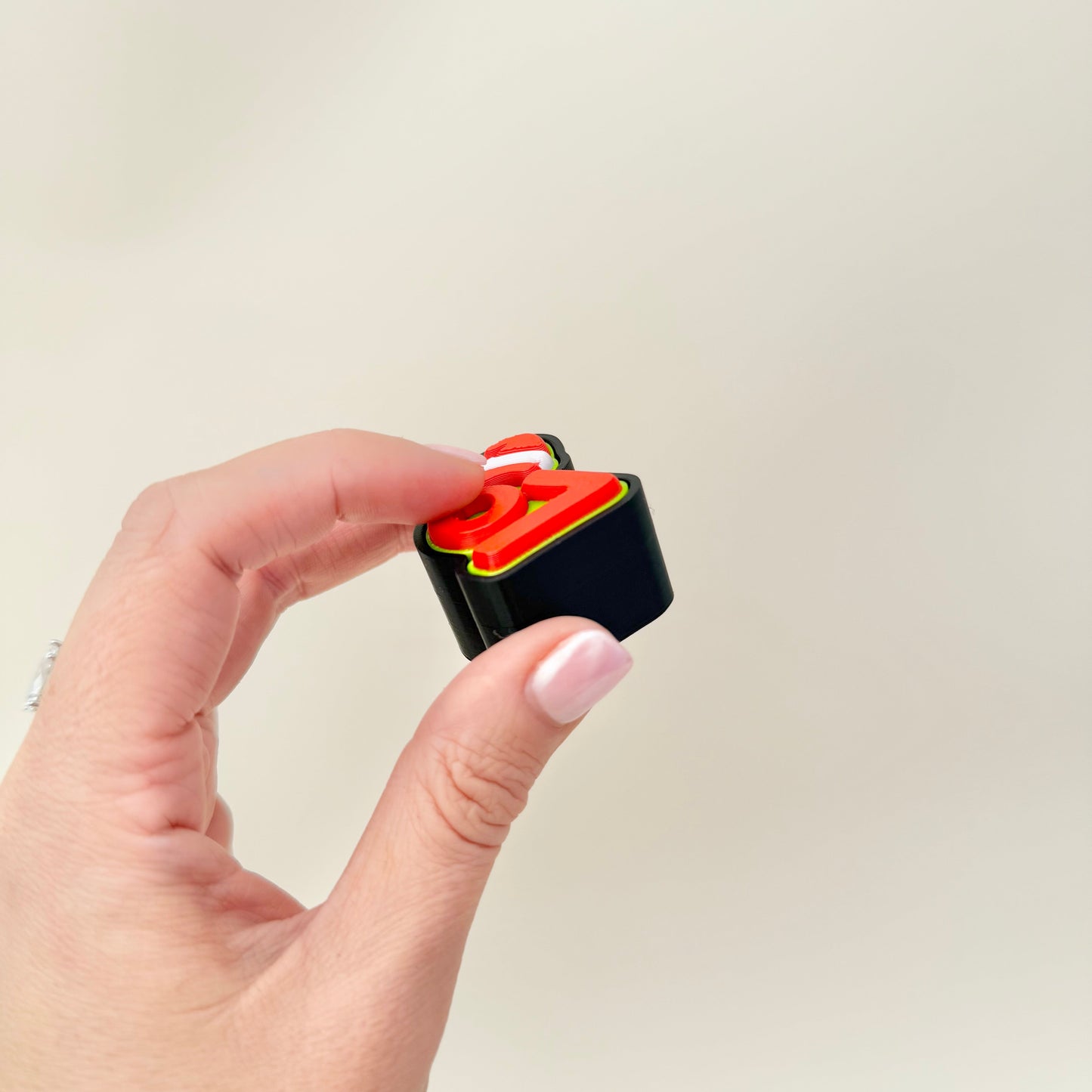 67 clicker with Santa hat; built-in holes for adding a keyring or lanyard, durable and pocket sized.