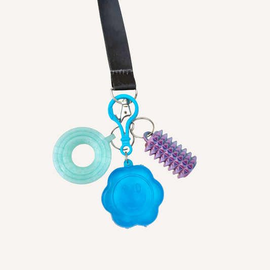 Small clip fidget for keys, bags or lanyards, offering calming tactile input and discreet squeezing for busy hands.