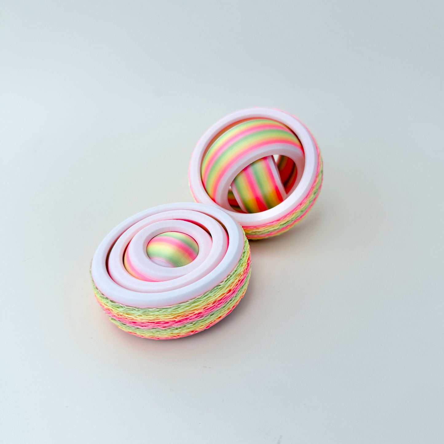 Nested rings rotate smoothly together for controlled, satisfying spins.