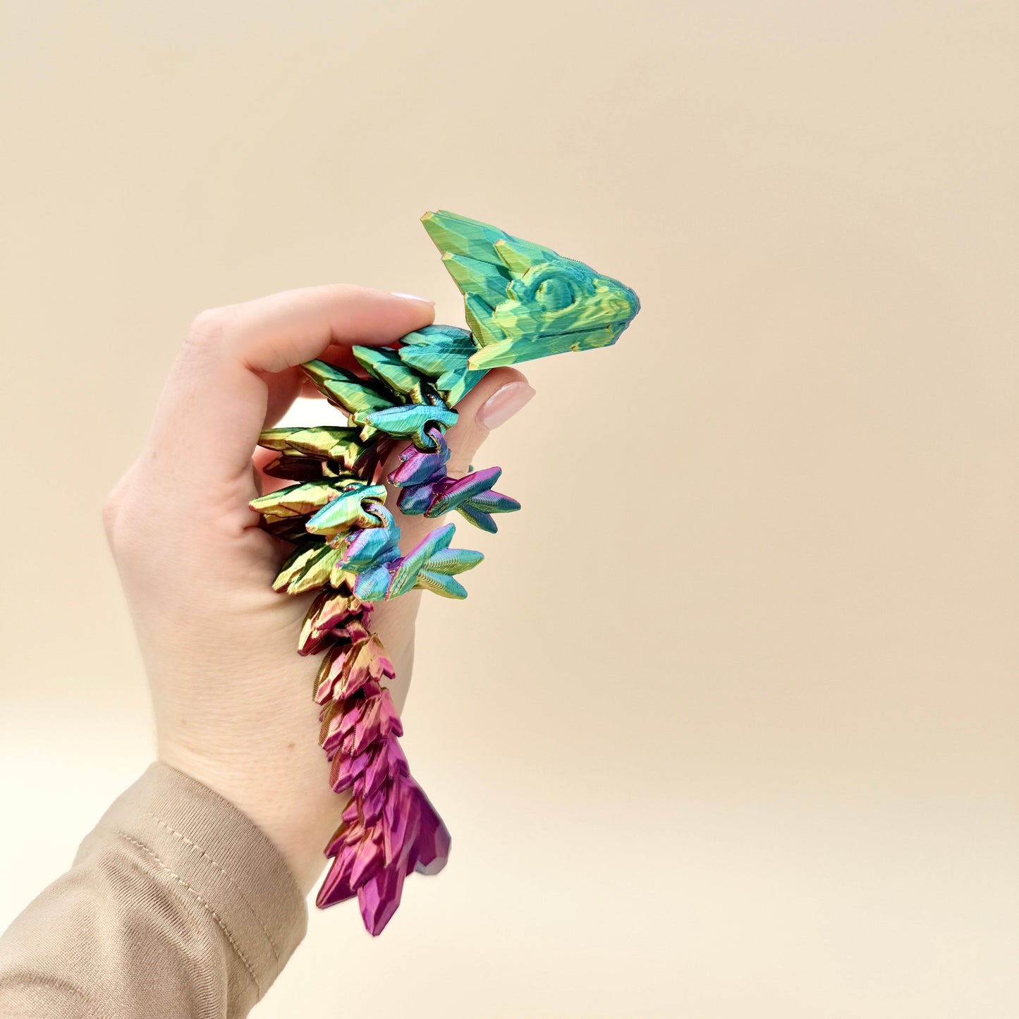 Stunning mini dragon fidget toy, available in two colour-changing variants, perfect for play or display.