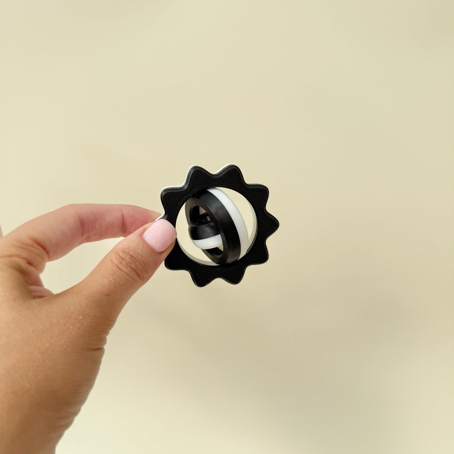 black and white sensory spinner for focus, grounding and discreet fidgeting