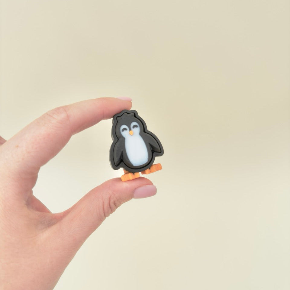 winter-themed tactile clicker in black, white and orange