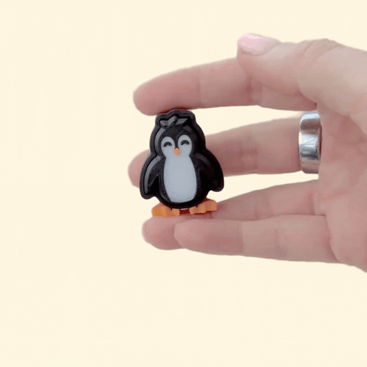 4 cm handheld fidget; smooth body, gentle ridges, satisfying click