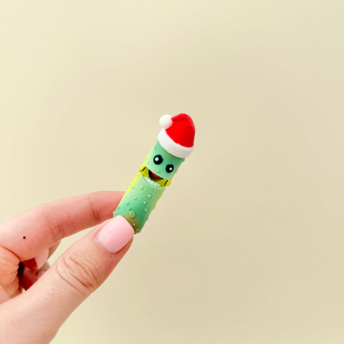 Small hand-friendly fidget with light texture for thumb tracing.