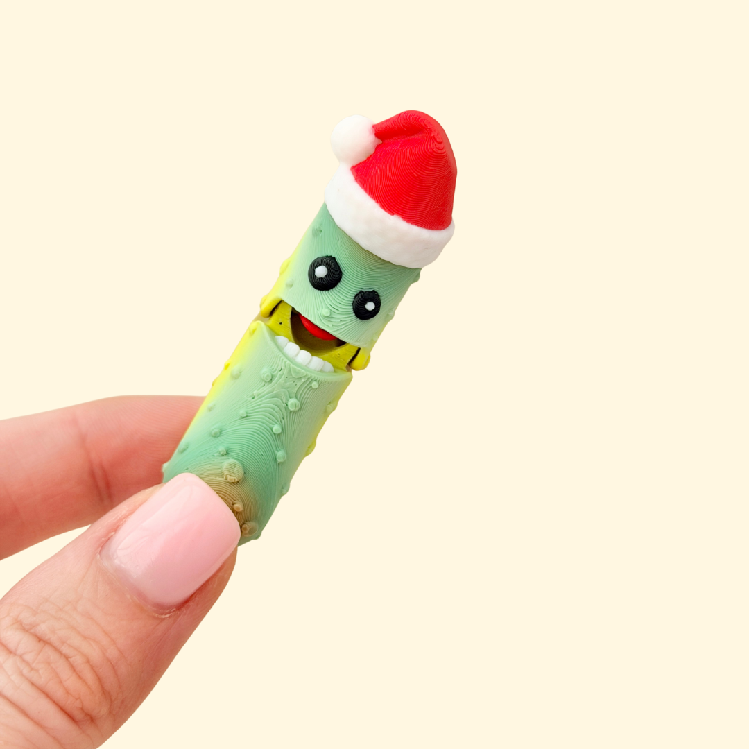 Mini festive character with a red hat and a press-to-chomp action.