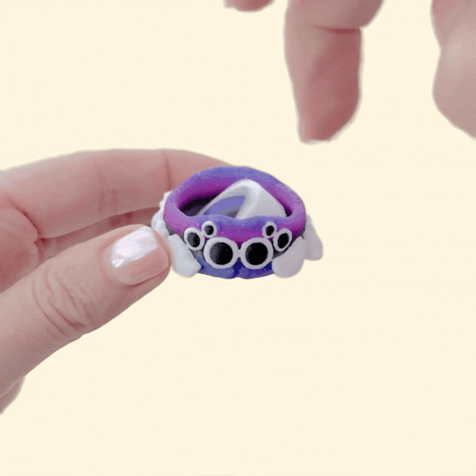 4.4 cm fidget spinner shaped like a cute jumping spider for one-handed spinning.