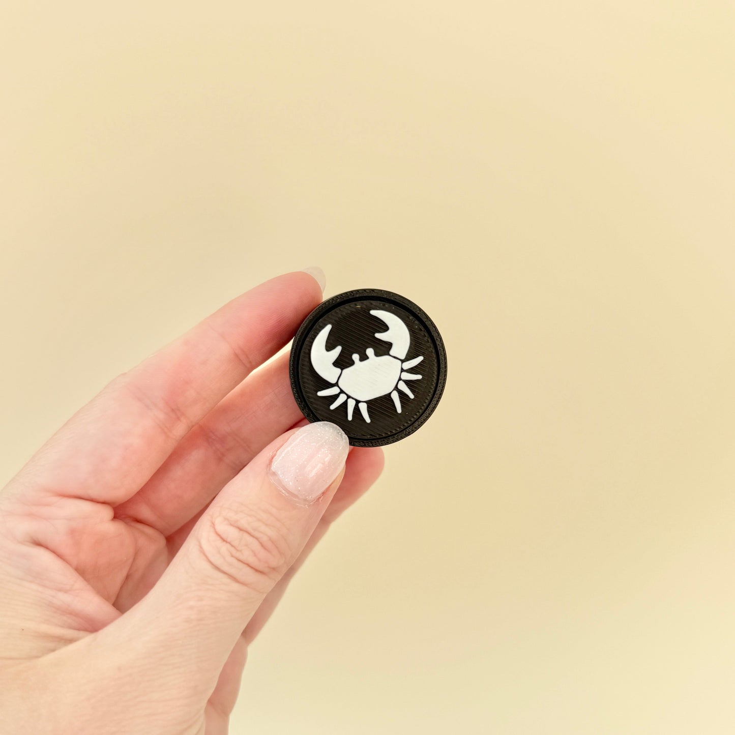 Compact fidget tool featuring zodiac signs, perfect for on-the-go sensory feedback and calming anxiety.