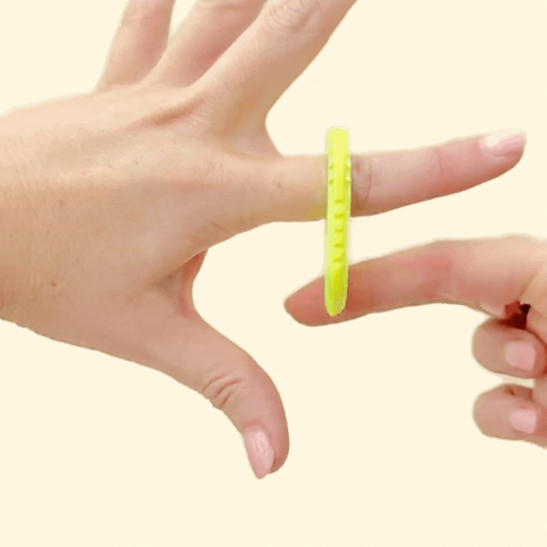 Flat fidget design with ridged textures and smooth grip points.