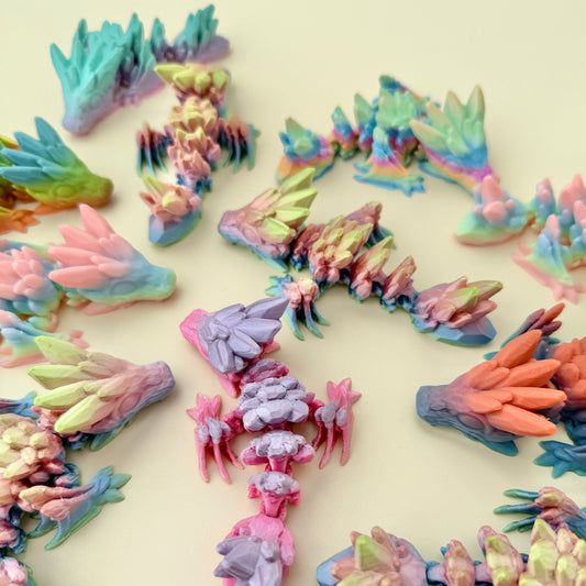 Compact sensory dragon toy featuring crystal-like textures and fully movable joints.