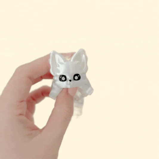 Flexible fox fidget with bendy spine and tail; silky finish for soothing tactile feedback.