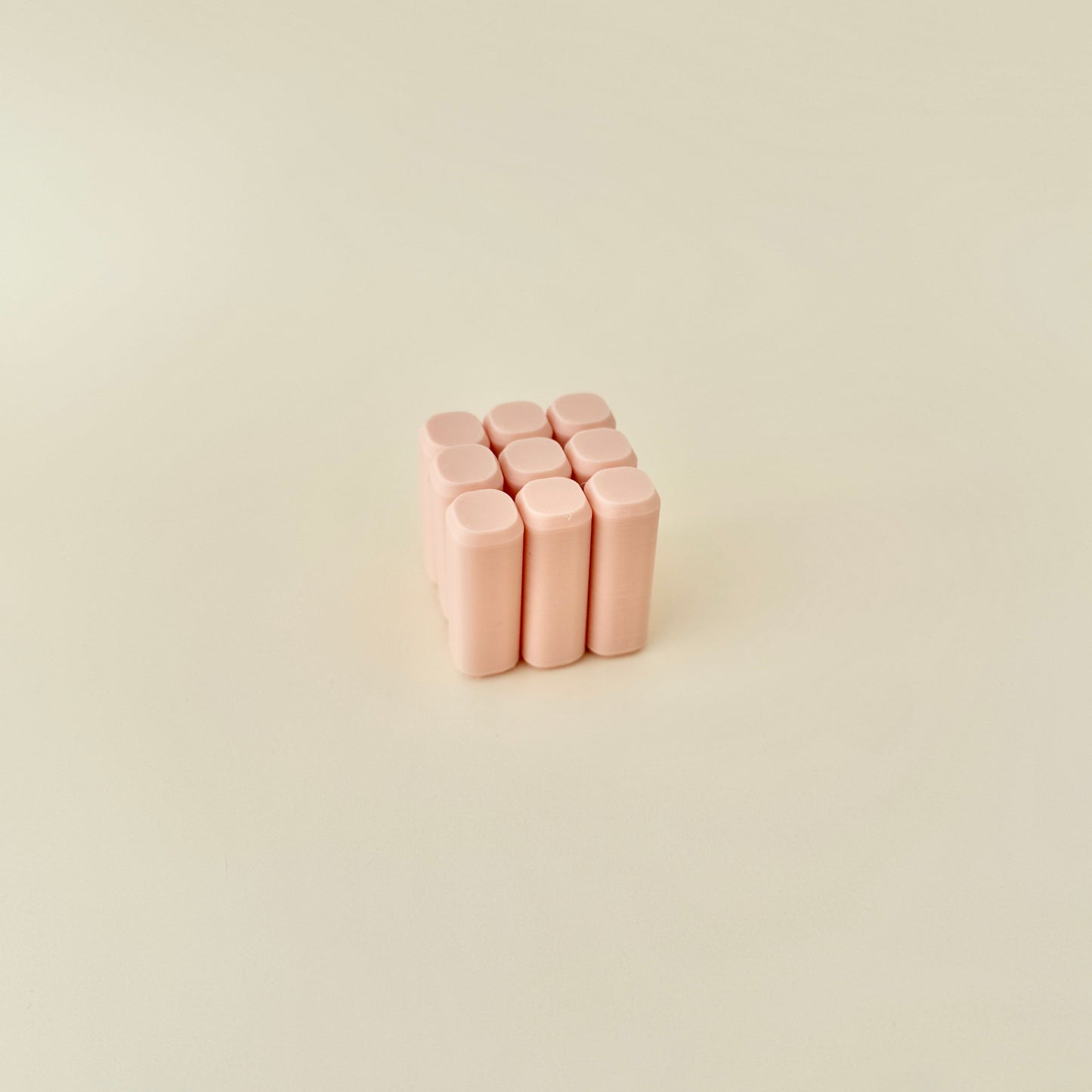 A smooth-edged sensory toy with a gentle movement and subtle clicking sound.