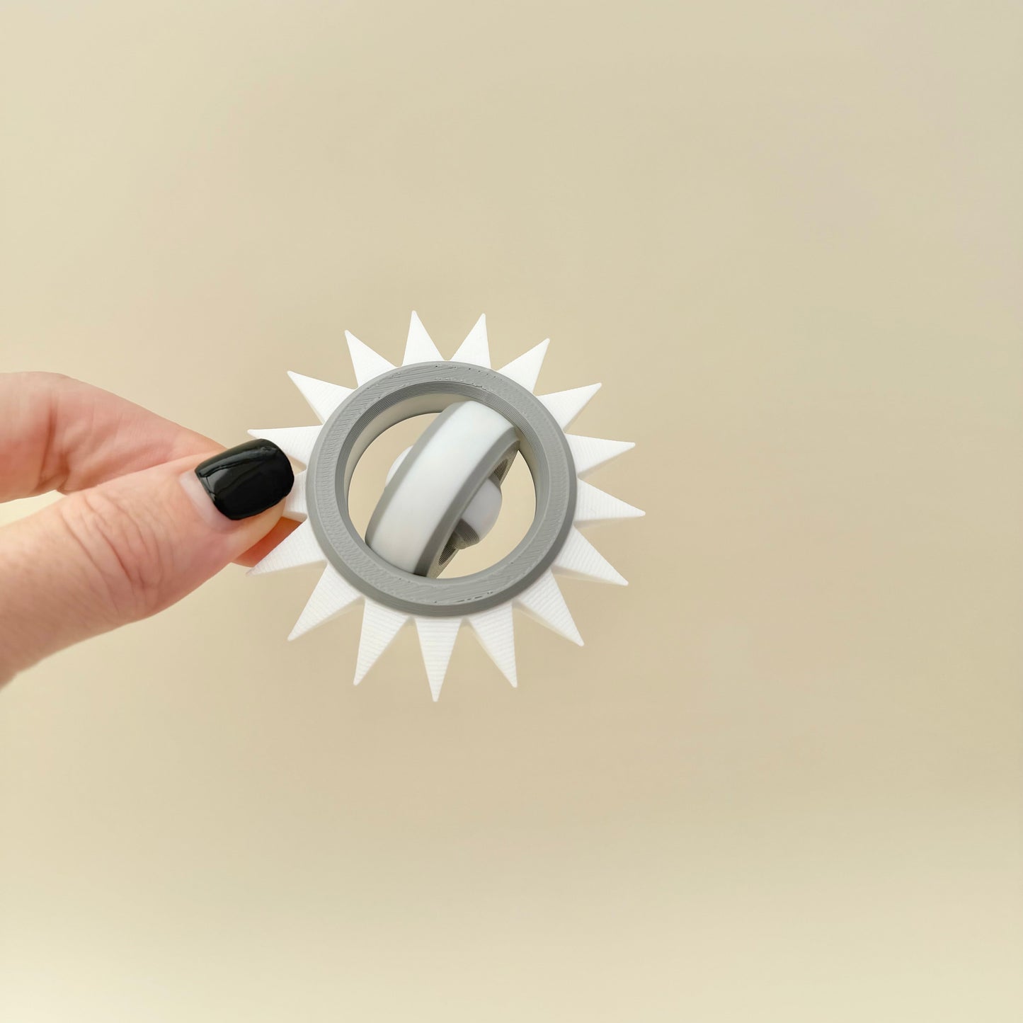 adult sensory spinner with sharp outer edge for controlled pain stimming