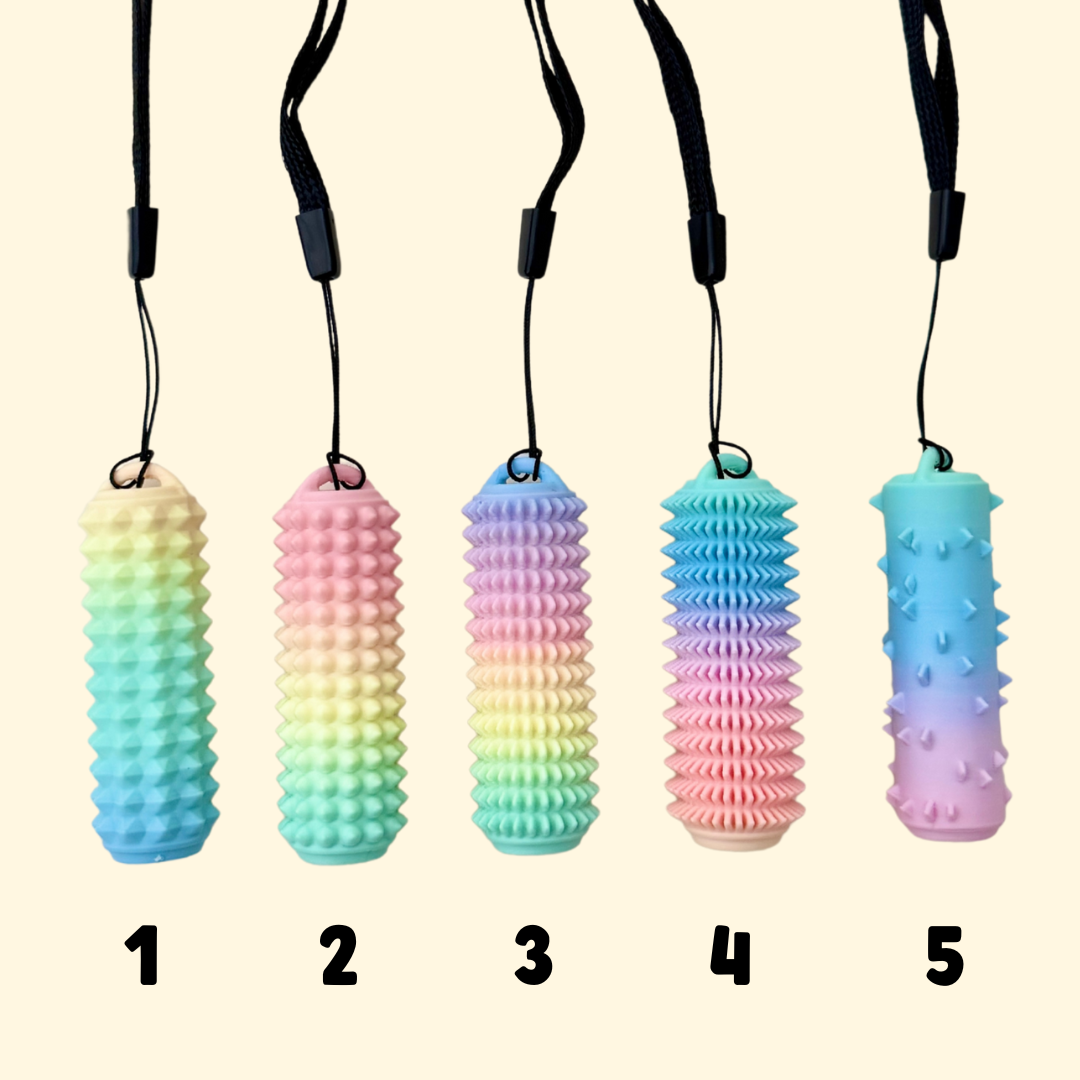 Textured sensory stim tools in rainbow and nude tones, designed for palm use