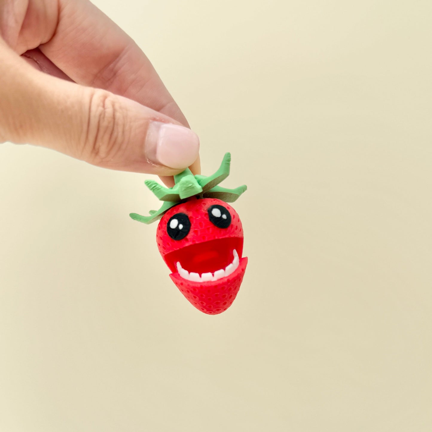 pair of quiet strawberry fidget toys with spinner tops for on-the-go regulation